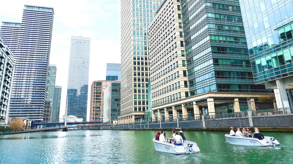 Image shows two GoBoats sailing in Canary Wharf