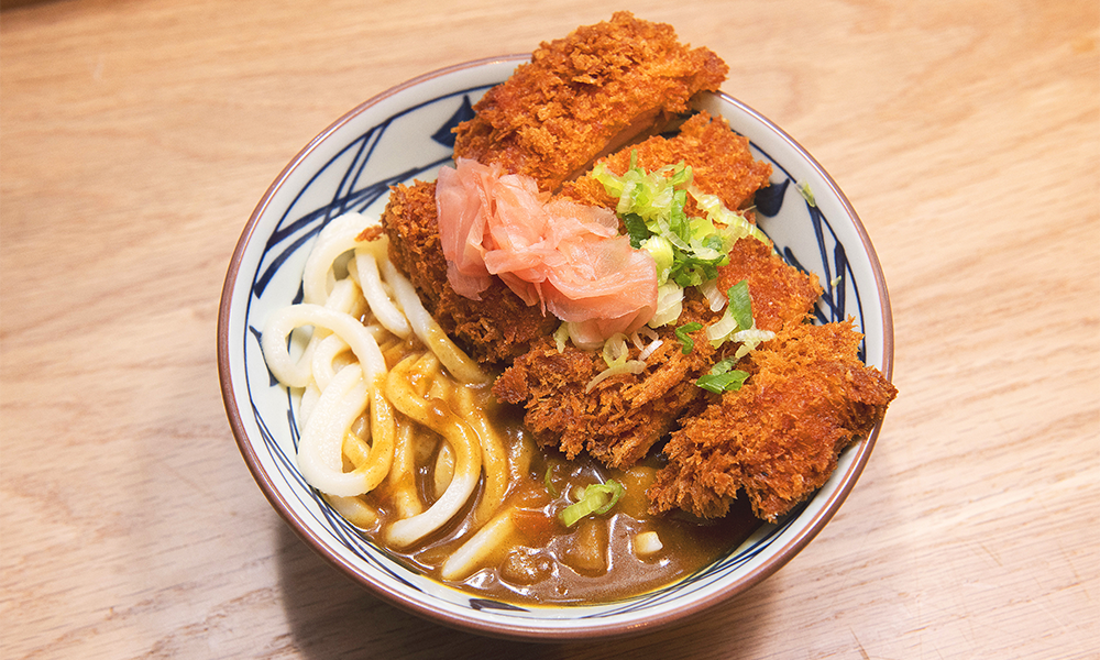 Chicken Katsu Curry Udon, served in a reusable bowl 