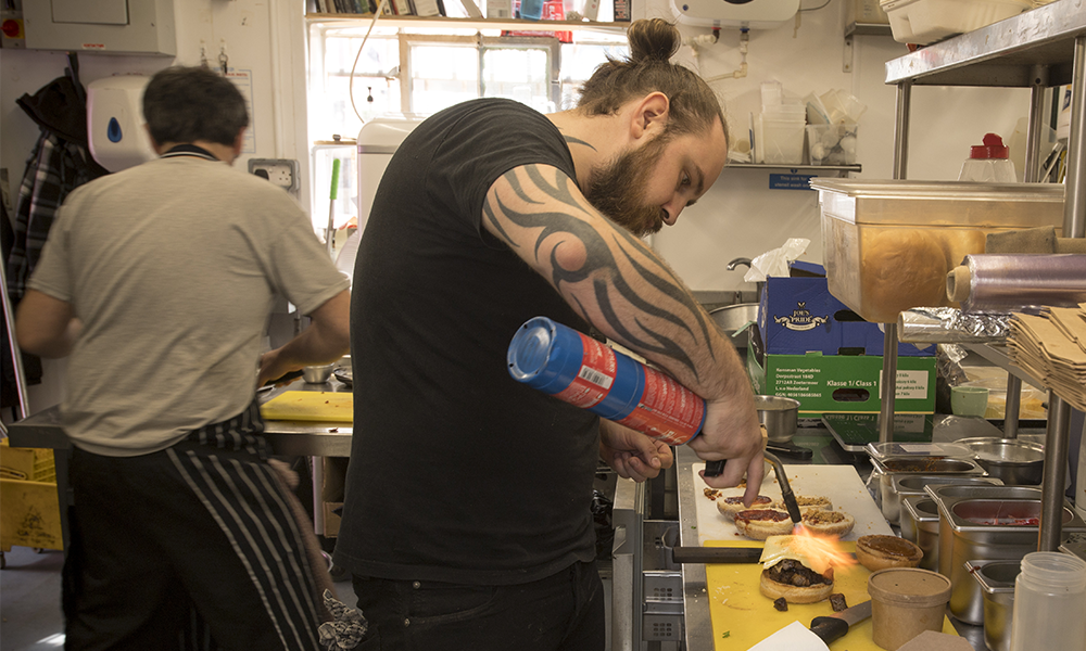 Curtis at wok in the kitchen