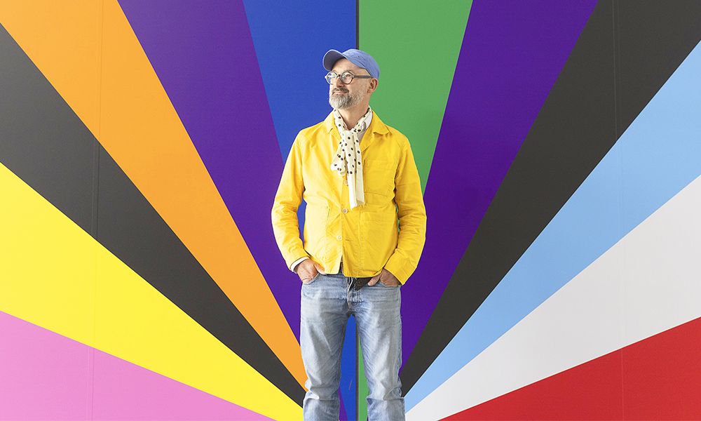 Lothar stands in front of part of his work Electro-Rainbow