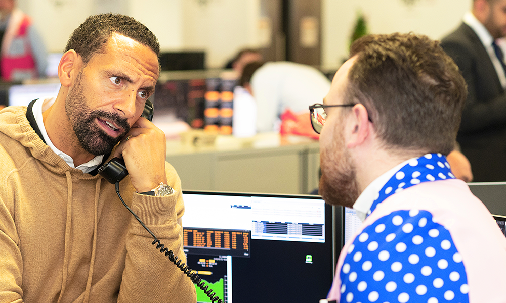 
Rio Ferdinand works the phones at the event - image James Perrin