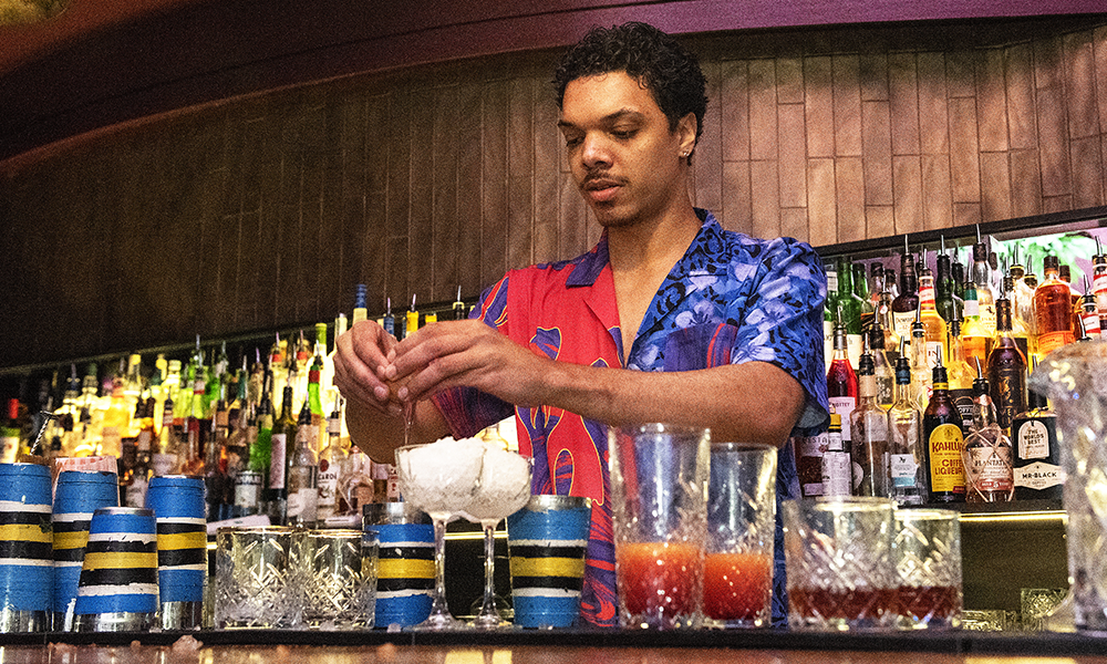 A bartender creates a drink at The Cocktail Club 