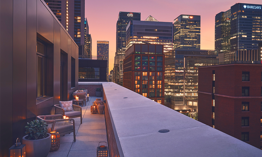 Image shows a terrace at 8 Harbord Square with views of the Canary Wharf skyline in the background