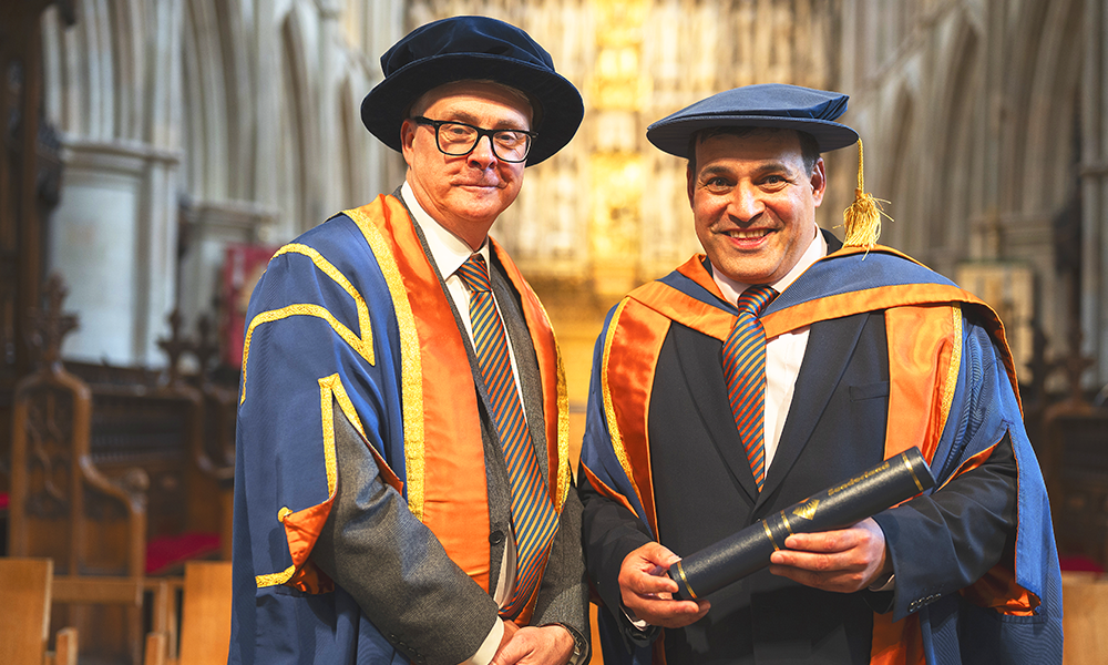 Image shows Alan Hardie and Jonathan Ganesh celebrating his honorary fellowship