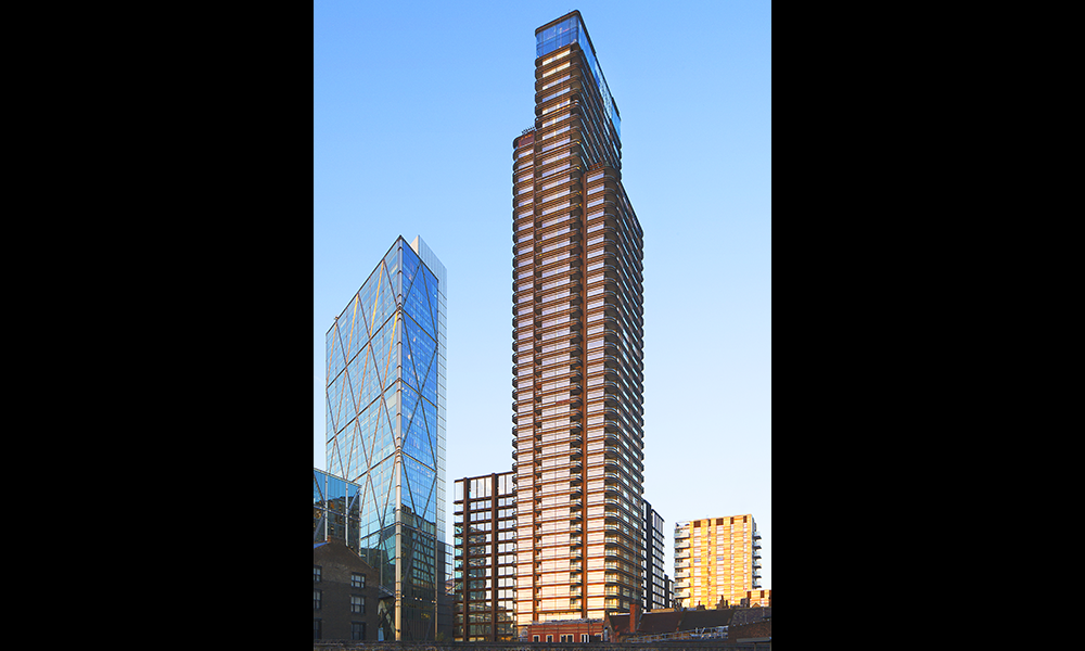 Image shows a tall residential tower block with three volumes and curved corners – it's Principal Tower in Shoreditch