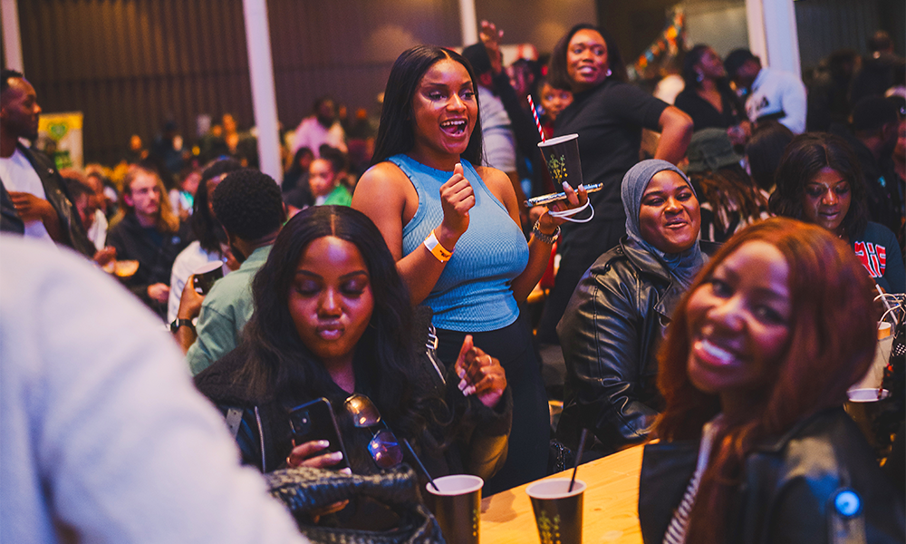 Image show women enjoying drinks at Black Eats Fest at Woolwich Works' Fireworks Factory venue