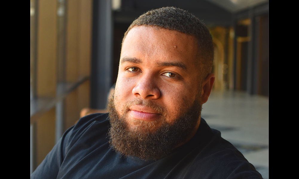 Image shows Black Eats founder Jackson Mclarty at Woolwich Works, a man with a full beard and tightly cropped dark hair