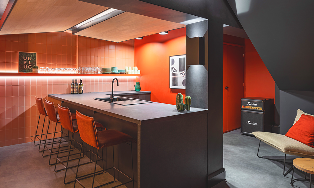 Image shows an interior by 3equals1 Design for a show room in Clerkenwell. Features include orange and dark grey walls