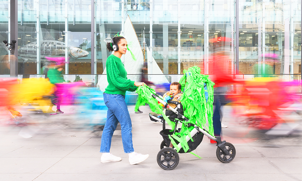 Image shows a woman with a pram participating in a Parkworks event at Greenwich + Docklands International Festival 2024