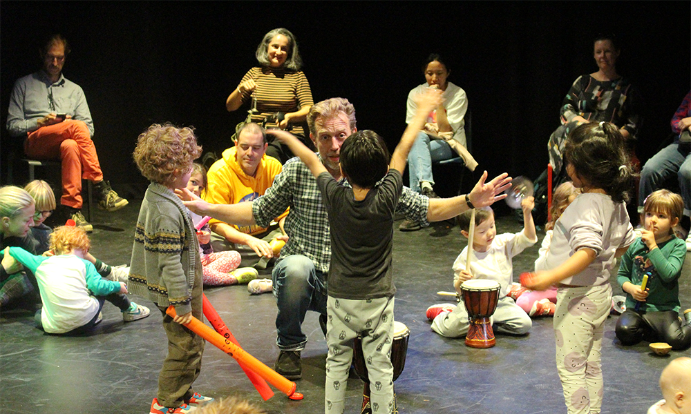 Images shows kids and their carers enjoying a Fun Palaces event at Half Moon Theatre