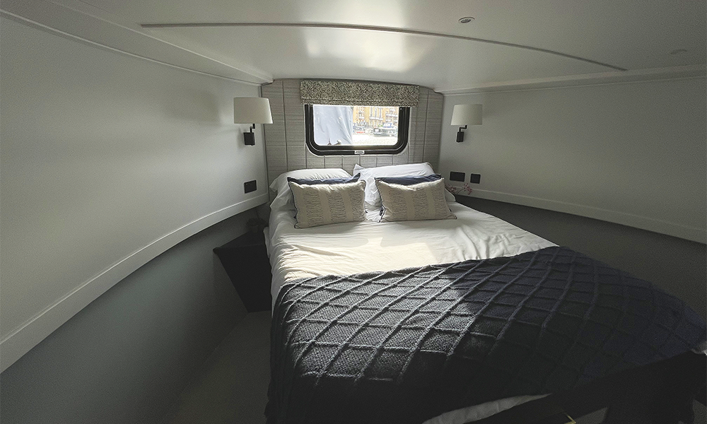 Image shows a master bedroom in a newly built house boat at Limehouse Marina, for sale with Boat Sales by Aquavista