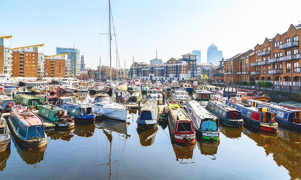 Image shows house boats on residential moorings at Limehouse Marina