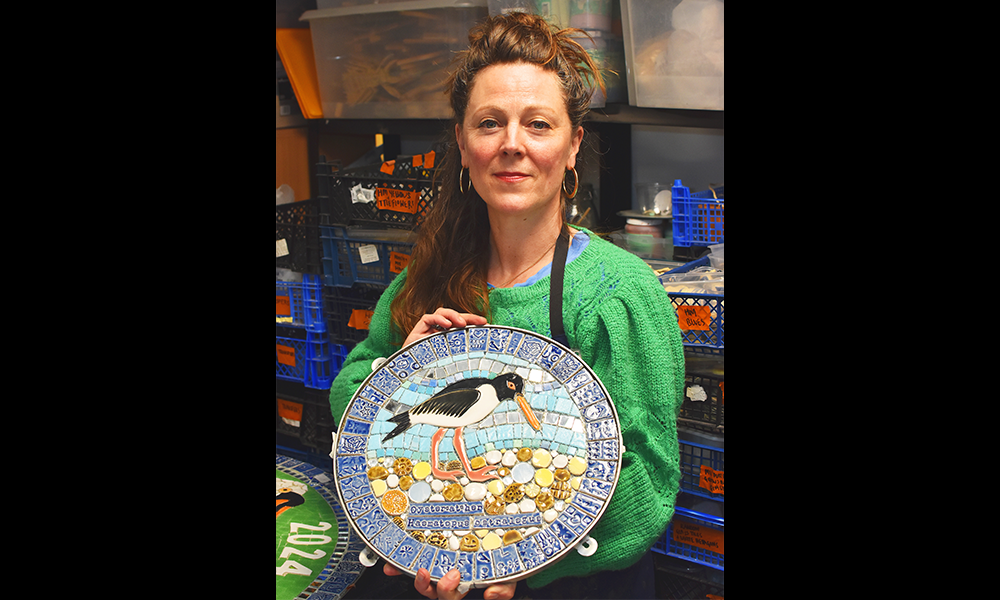 Maud with one of the mosaic's she and her team have created for the project