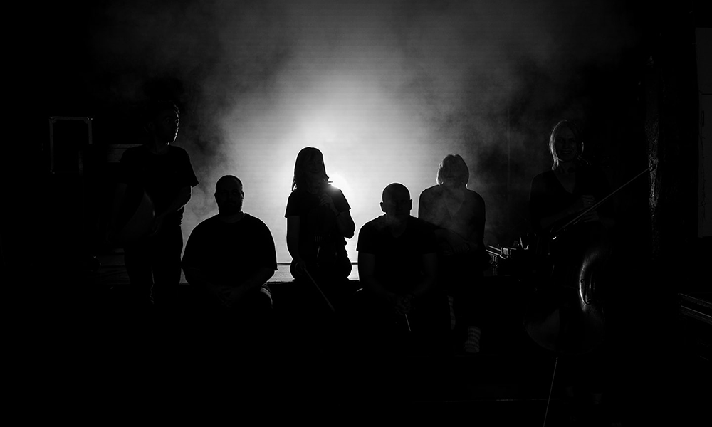 Performers play in the dark, with audience members wearing eye masks to minimise distraction