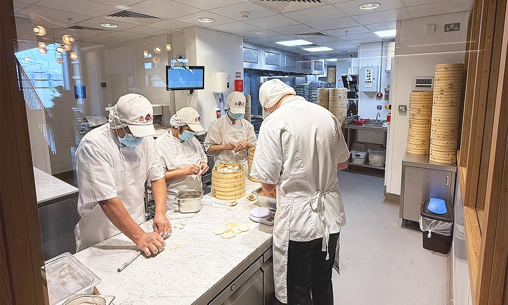 Chefs at Din Tai Fung, hard at work making Xiao Long Bao dumplings - image by Jon Massey