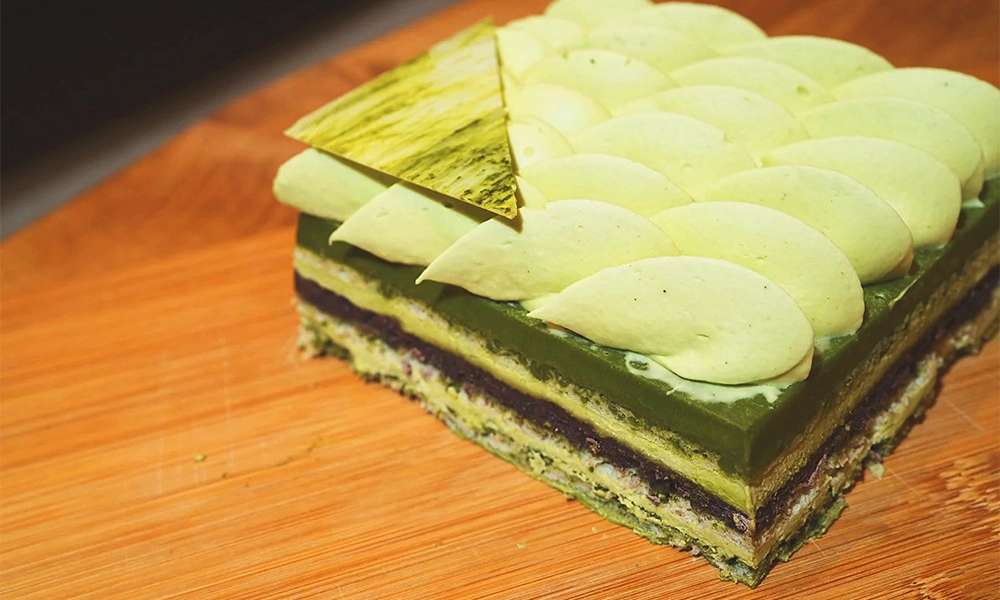 Café Seek’s Matcha Opera Cake, with layers of matcha joconde sponge, ganache, buttercream, red bean paste and matcha chocolate - image by Café Seek