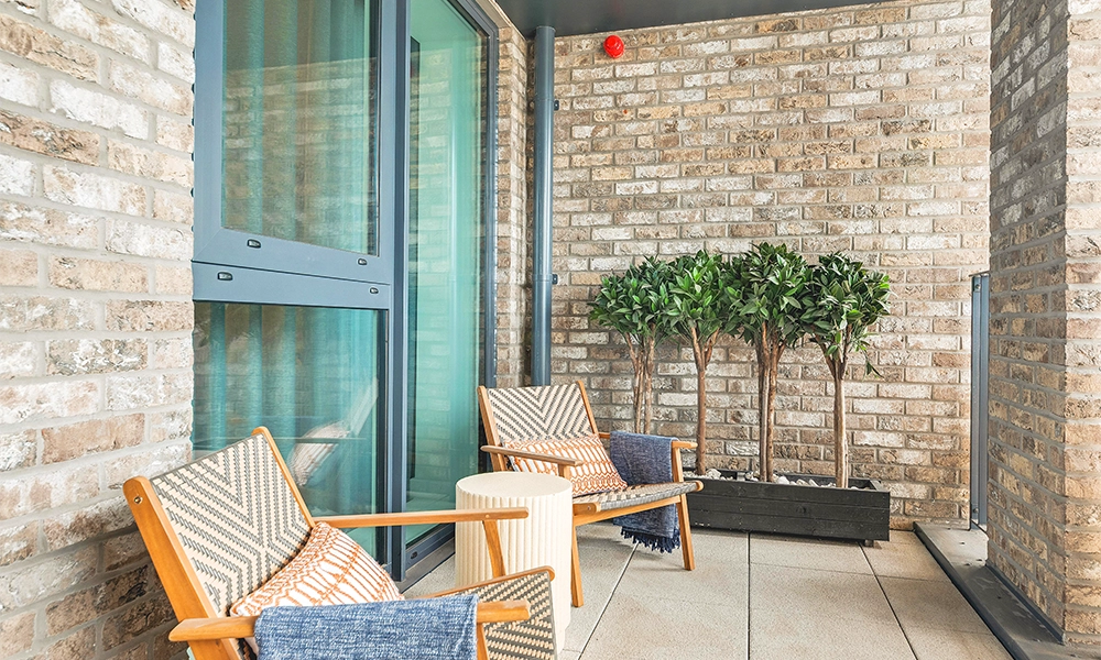 Apartments at Stories Wharf feature private balconies - image by Hyde New Homes