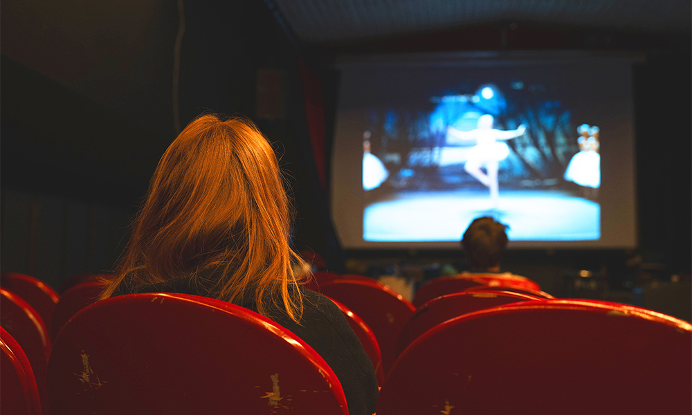 Audience members watch a film on board the floating venue - image by Theatreship