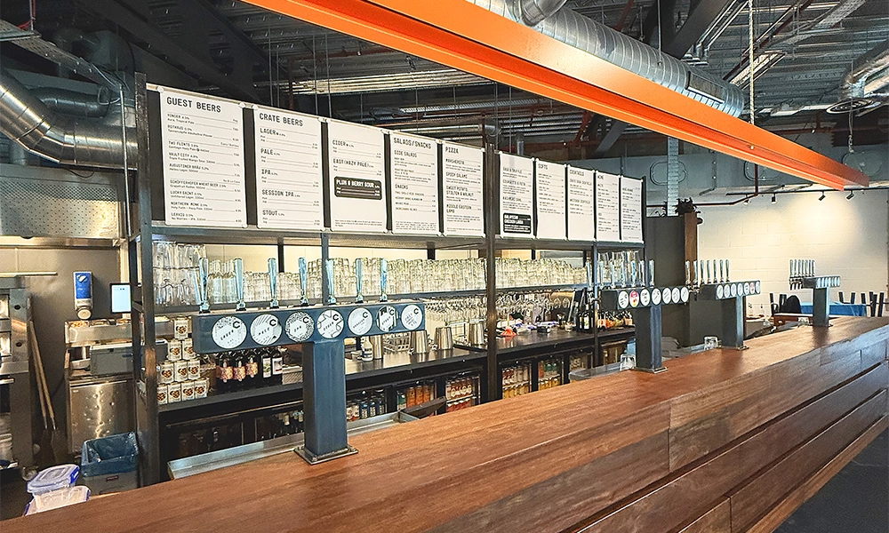 The venue's extensive bar has been built from reclaimed railway sleepers - image by Jon Massey / Wharf Life