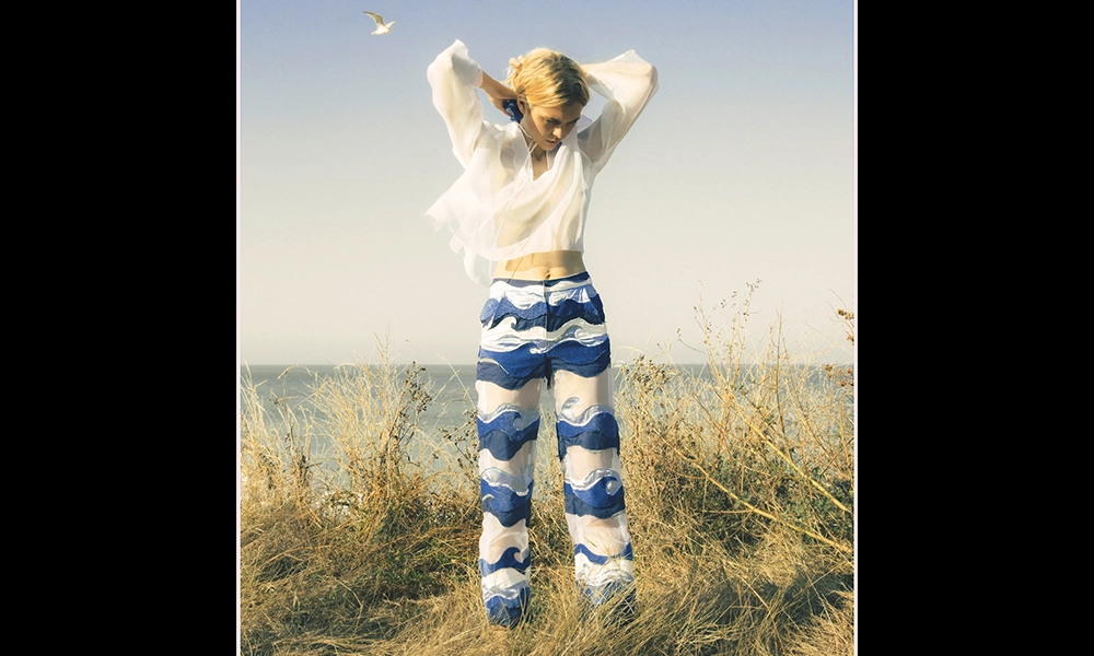 Wave Sheer Blouse, £175 and Wave Suit Trouser, £450, both by Omniss - image by Omniss