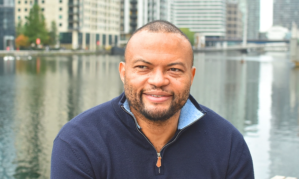 Amero founder Daniel Kemdeng outside his home in Canary Wharf - image by Jon Massey / Wharf Life