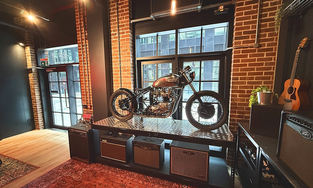 Kitchen Jam comes complete with amps, guitar and a vintage Triumph motorbike - image by Jon Massey / Wharf Life