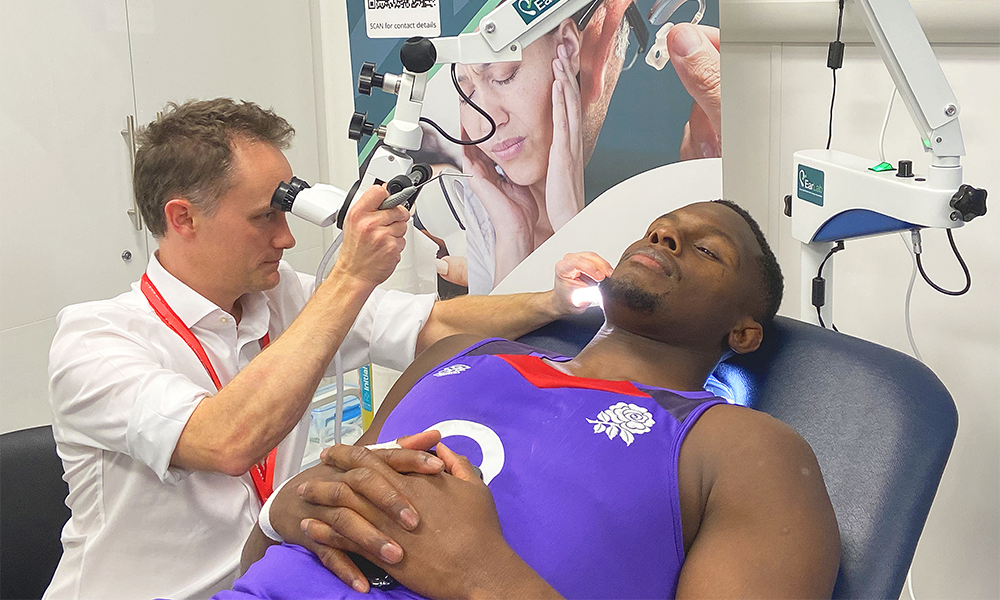 David clears England Rugby captain Maro Itoje's ears - image supplied by EarLab