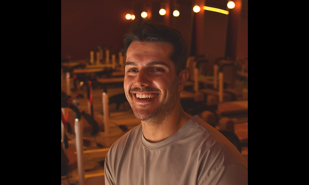 Julio Nadalini sits amid The Garnet Fitness Studio's suite of Reformers - image by Jon Massey / Wharf Life
