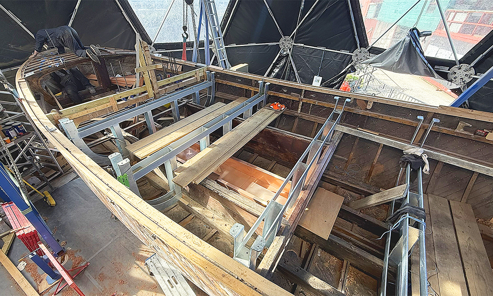 Sections of frame are installed in the boat ready for the vessel to be flipped over - image by Nicholas Alexander