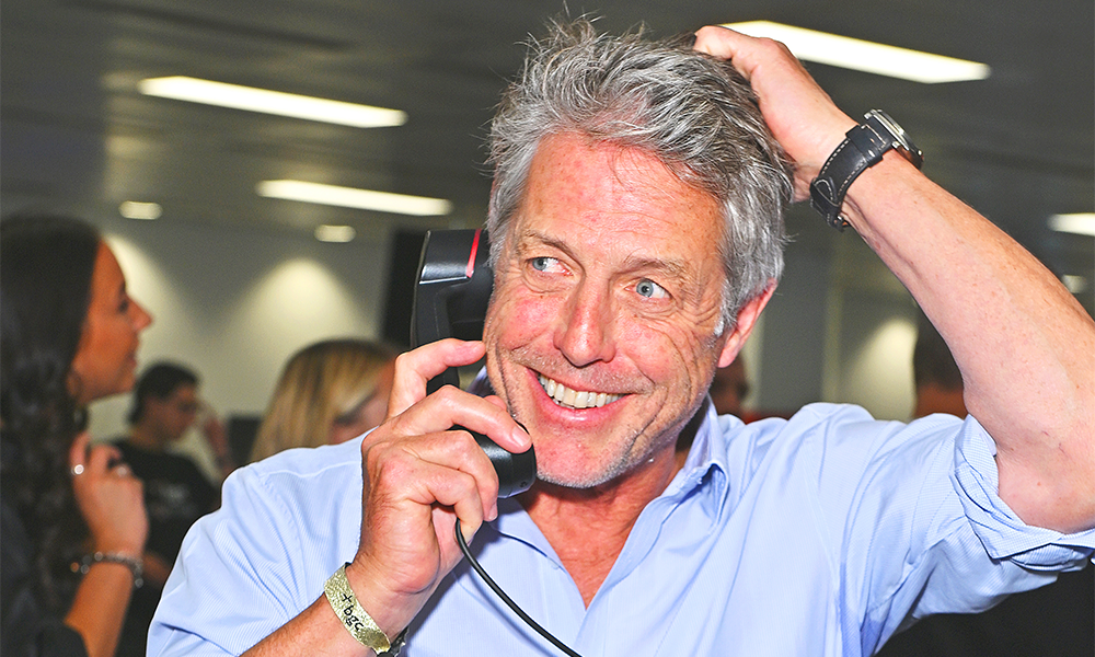 Hugh Grant hits the phones on behalf of the Press Justice Project - image by Dave Benett/Getty Images for BGC Group