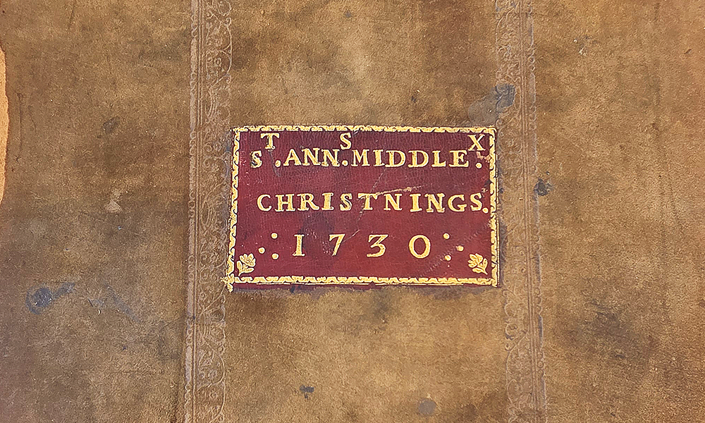 The cover of the book containing St Anne's christening records from 1730 onwards - image supplied by Care For St Anne's